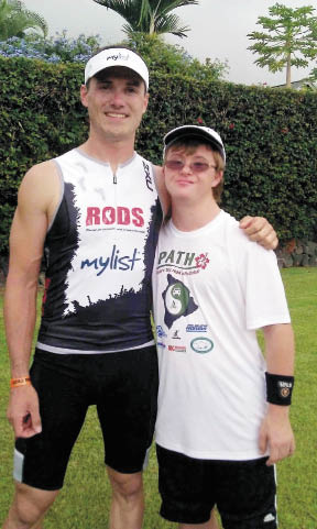 Brady Murray pictured with Alex, an athlete with Down syndrome.